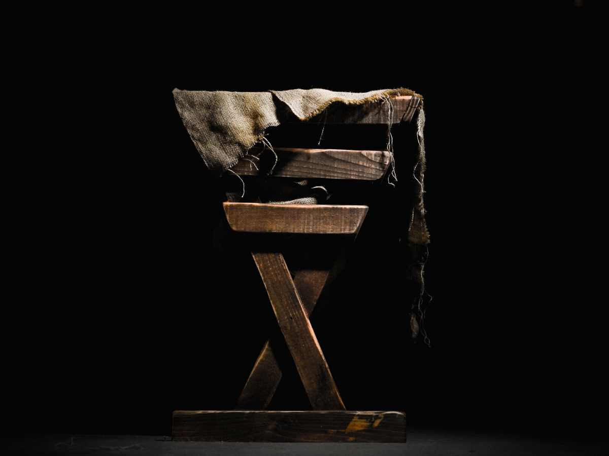 A manger in front of a black background